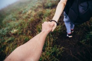 holding hands to indicate support